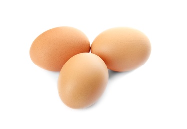 Raw brown chicken eggs on white background