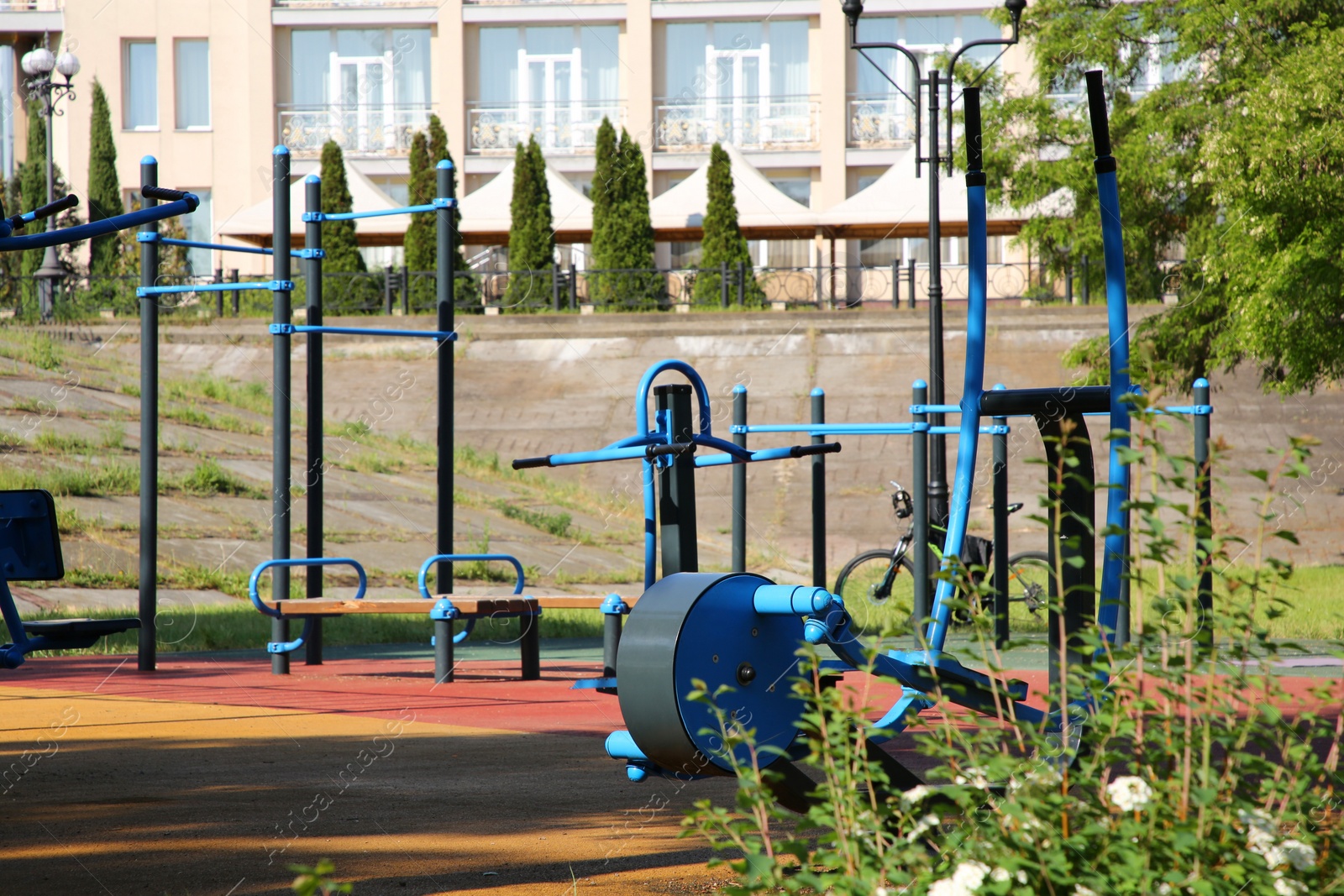 Photo of Empty outdoor gym with exercise equipment in park