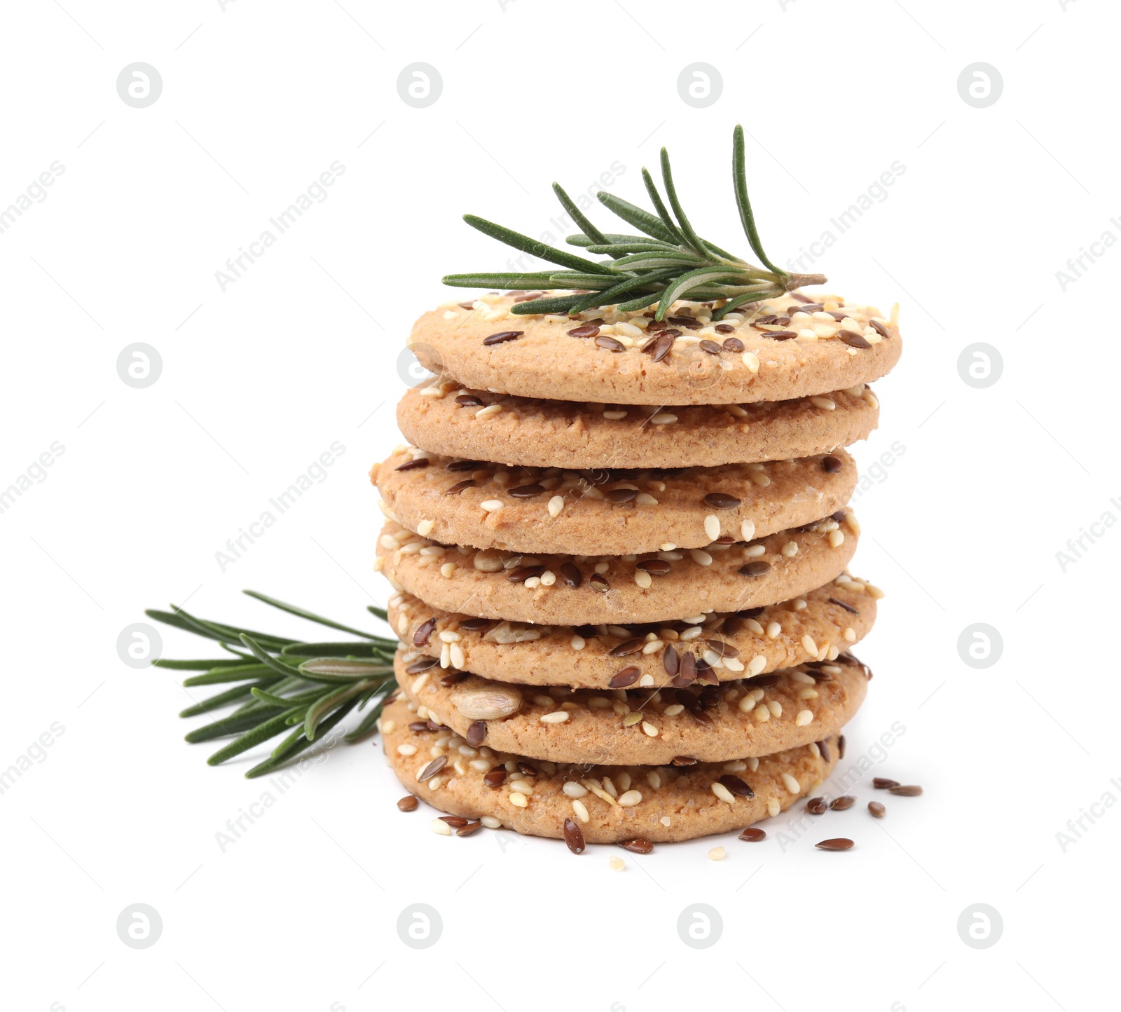 Photo of Stack of round cereal crackers with flax, sunflower, sesame seeds and rosemary isolated on white