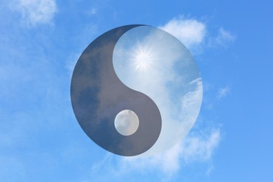 Image of Ying Yang symbol against blue sky. Feng Shui philosophy
