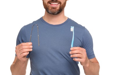 Photo of Man with tongue cleaner and plastic toothbrush on white background, closeup