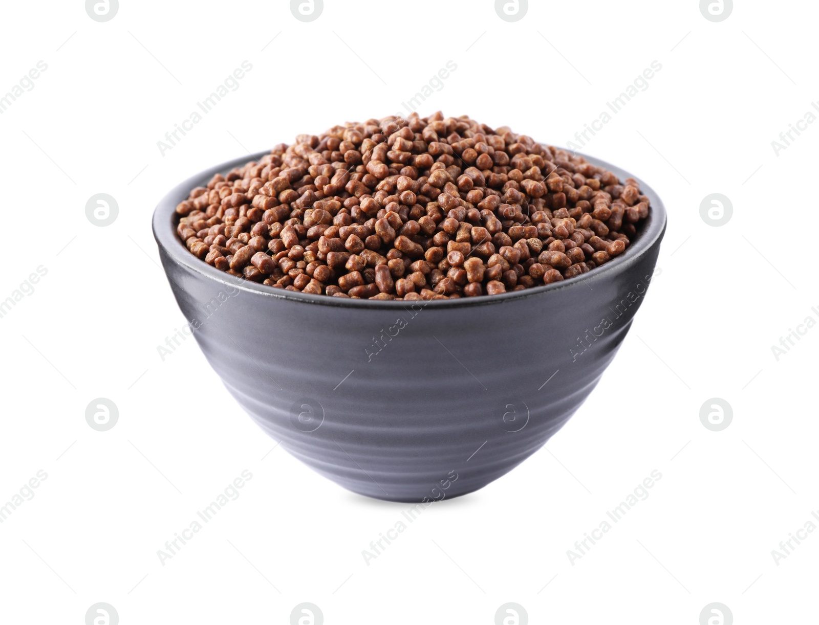 Photo of Buckwheat tea granules in bowl on white background
