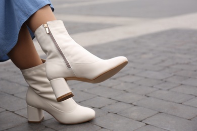 Photo of Woman wearing stylish leather shoes outdoors, closeup