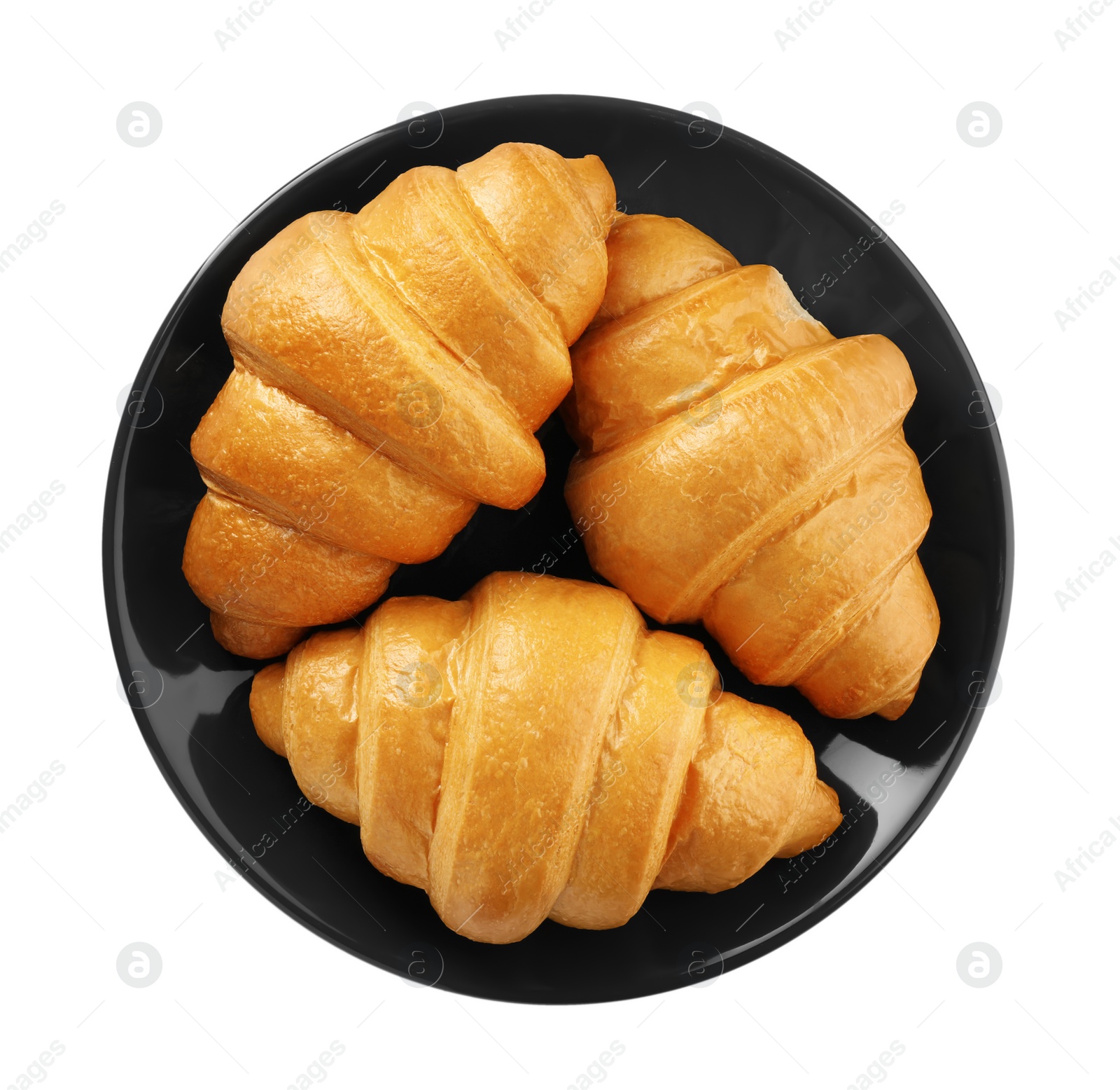 Photo of Plate with delicious fresh croissants isolated on white, top view