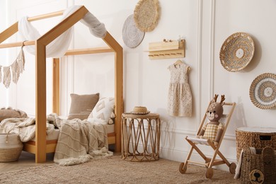 Stylish child room interior with house bed