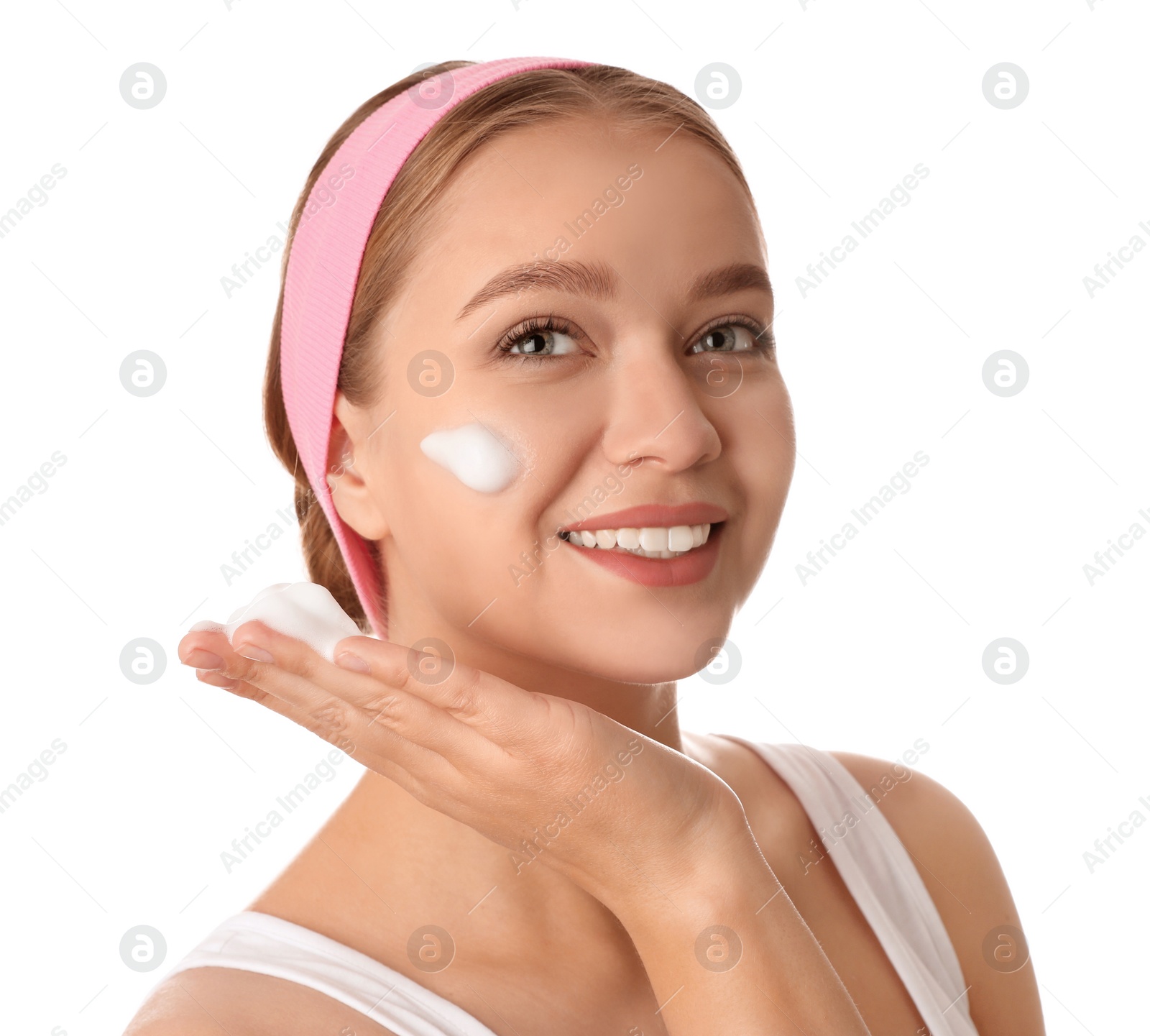 Photo of Young woman washing face with cleansing foam on white background. Cosmetic product