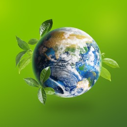 Image of Recycling concept. Earth planet with green leaves on color background