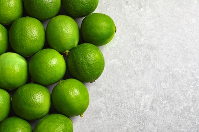 Photo of Fresh ripe green limes on light background