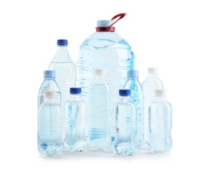 Set of different plastic bottles with pure water on white background