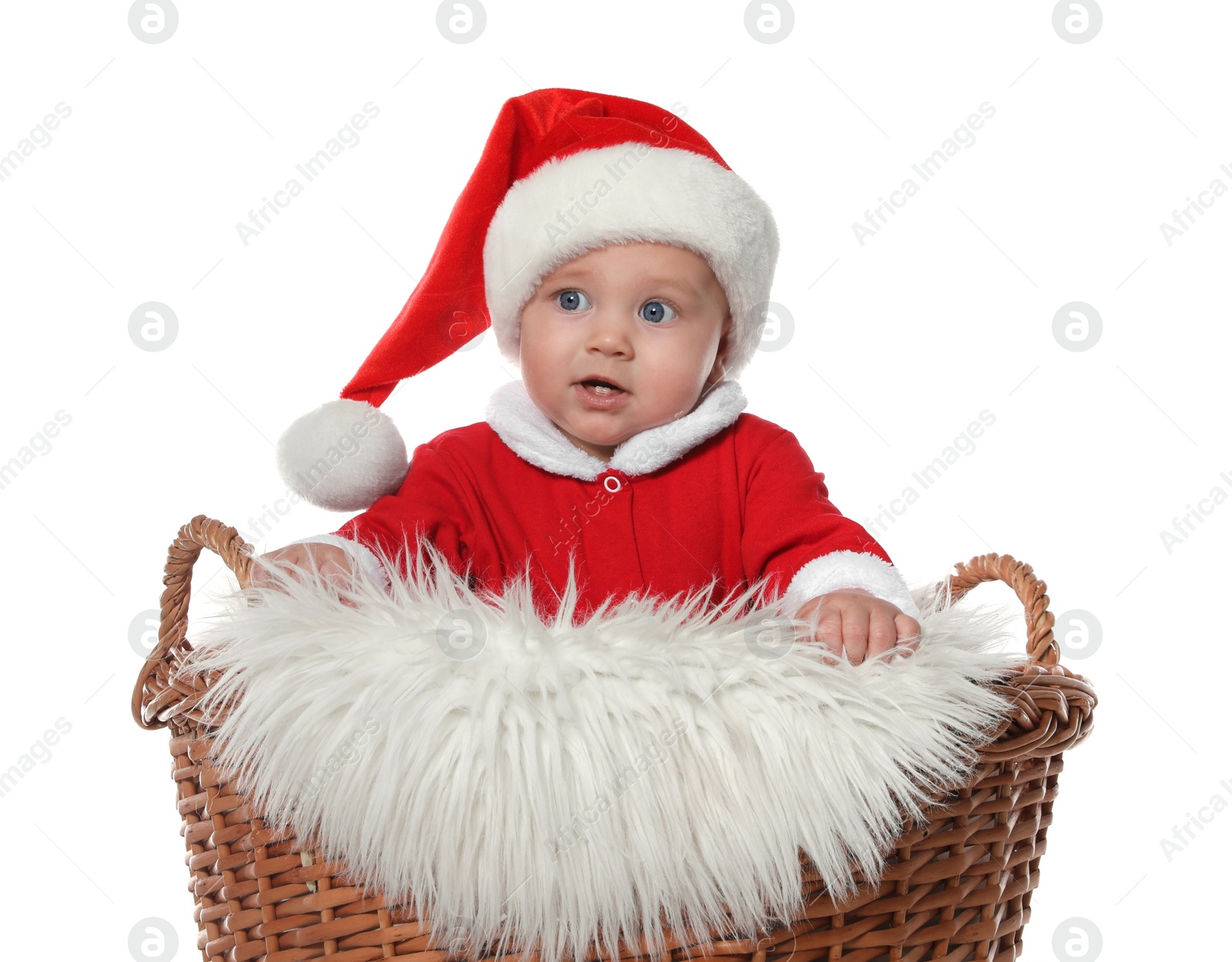 Photo of Cute baby in wicker basket on white background. Christmas celebration