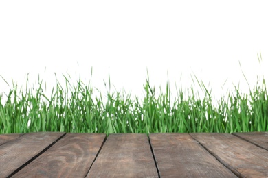 Photo of Wooden deck and green grass isolated on white