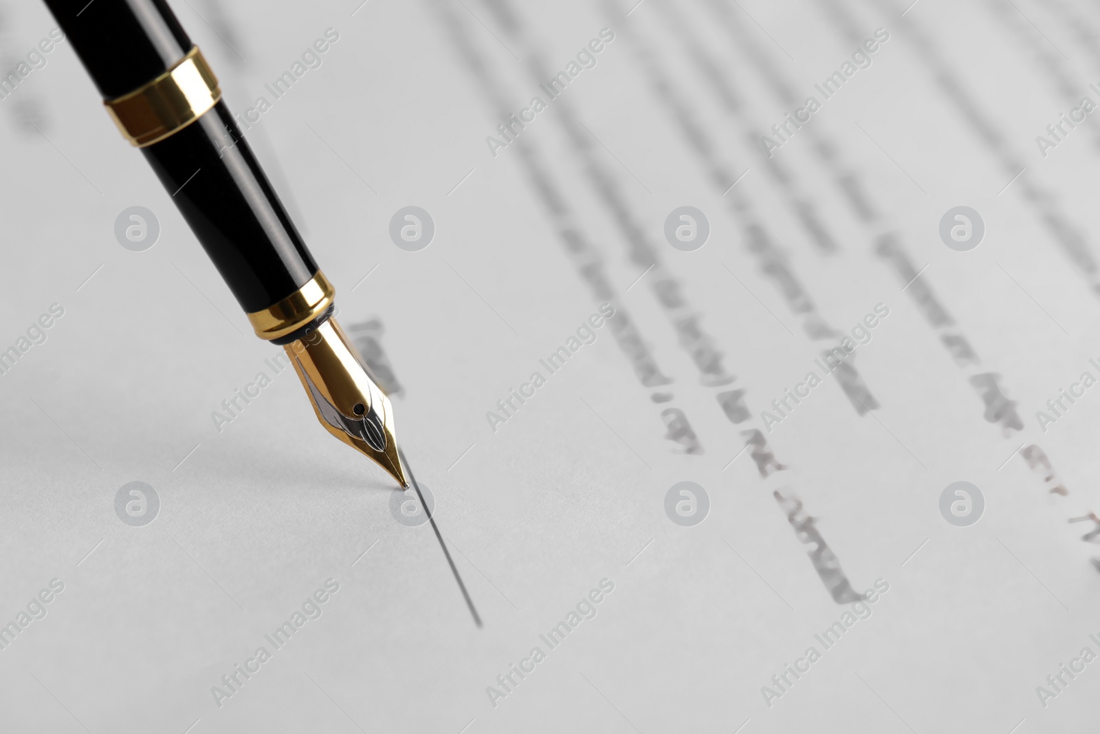 Photo of Writing on document with fountain pen, closeup. Notary contract