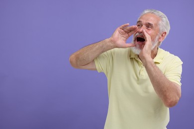 Photo of Special promotion. Senior man shouting to announce information on purple background. Space for text