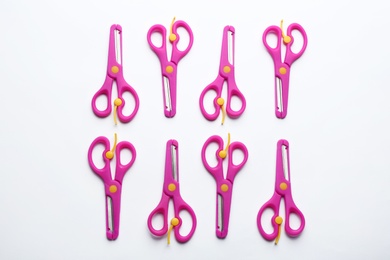 Set of training scissors on white background, top view