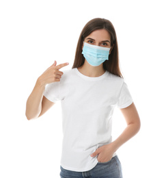 Photo of Female volunteer in mask on white background. Protective measures during coronavirus quarantine