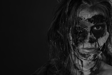 Scary zombie on dark background, black and white effect with space for text. Halloween monster