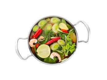 Saucepan of delicious vegetable soup with shrimps isolated on white, top view