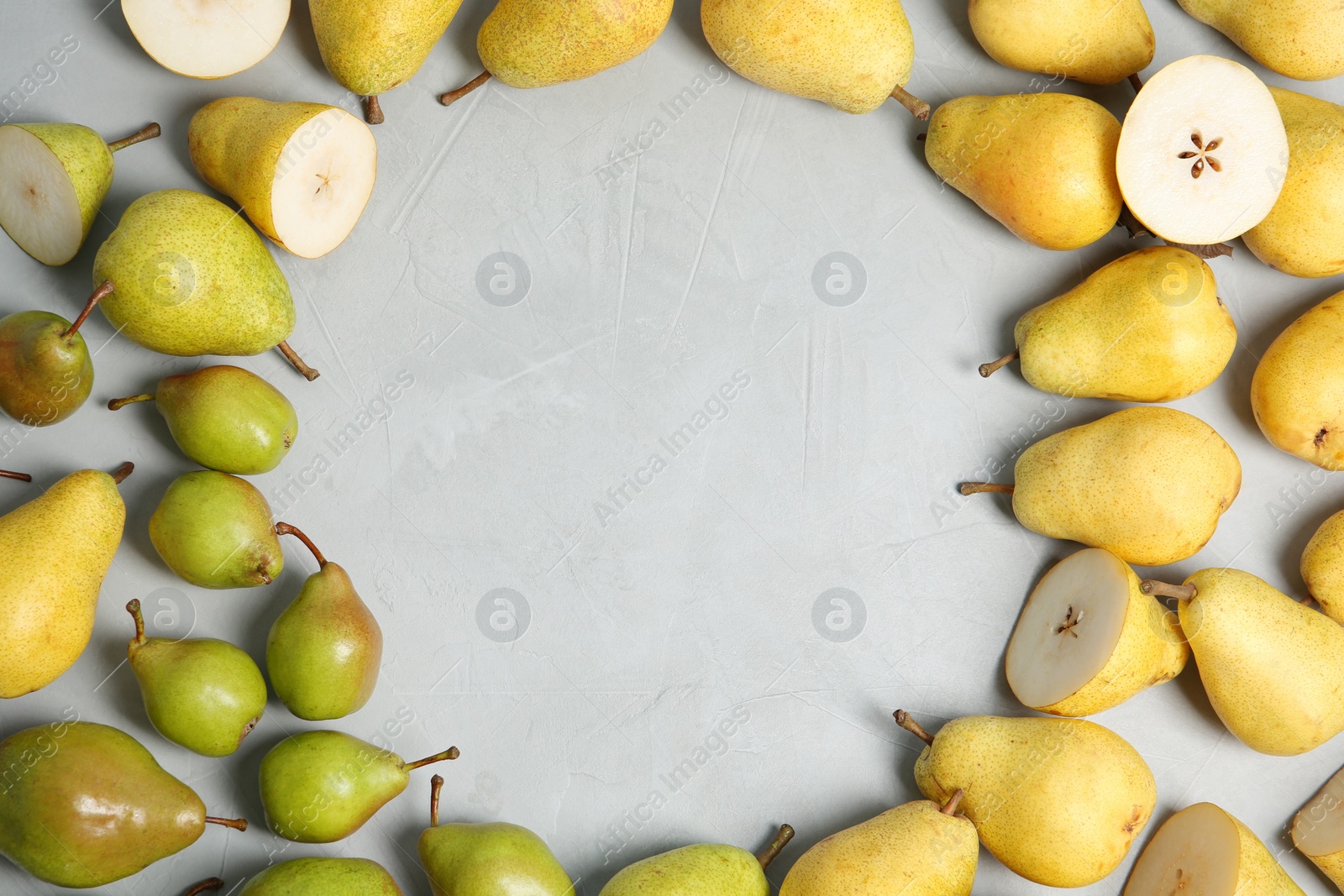 Photo of Flat lay composition with fresh ripe pears and space for text on gray background