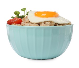 Photo of Tasty boiled oatmeal with fried egg, tomato and microgreens isolated on white