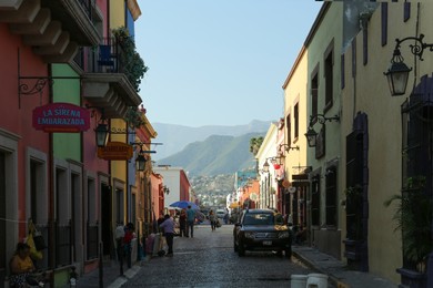 Photo of San Pedro Garza Garcia, Mexico - September 25, 2022: City street with beautiful buildings and people