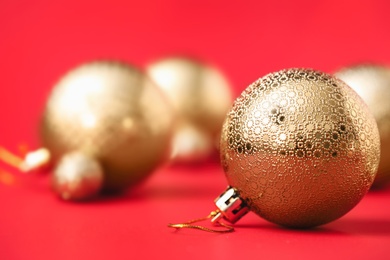 Photo of Beautiful Christmas balls on red background. Space for text