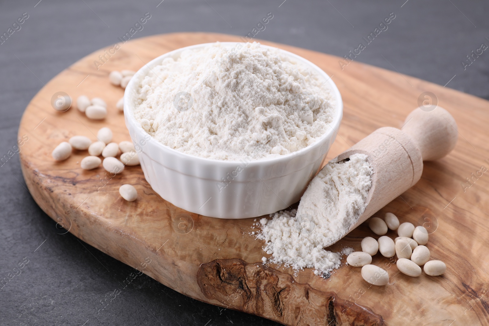 Photo of Bean flour and seeds on grey table