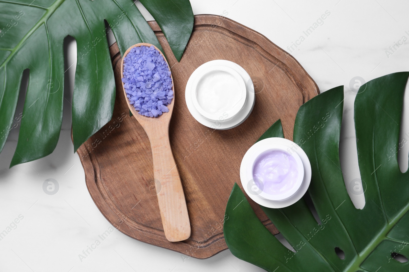 Photo of Flat lay composition with cosmetic products on white table