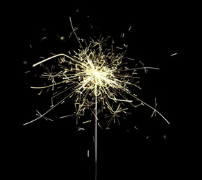 Image of Beautiful sparkler burning on black background. Party decor