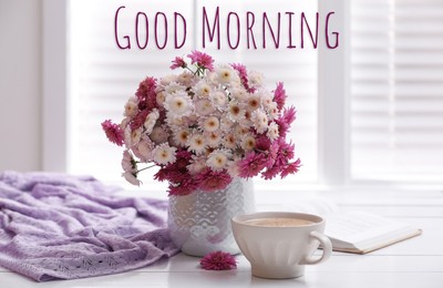Image of Good morning! Cup of fresh coffee, open book and beautiful bouquet on white wooden table near window