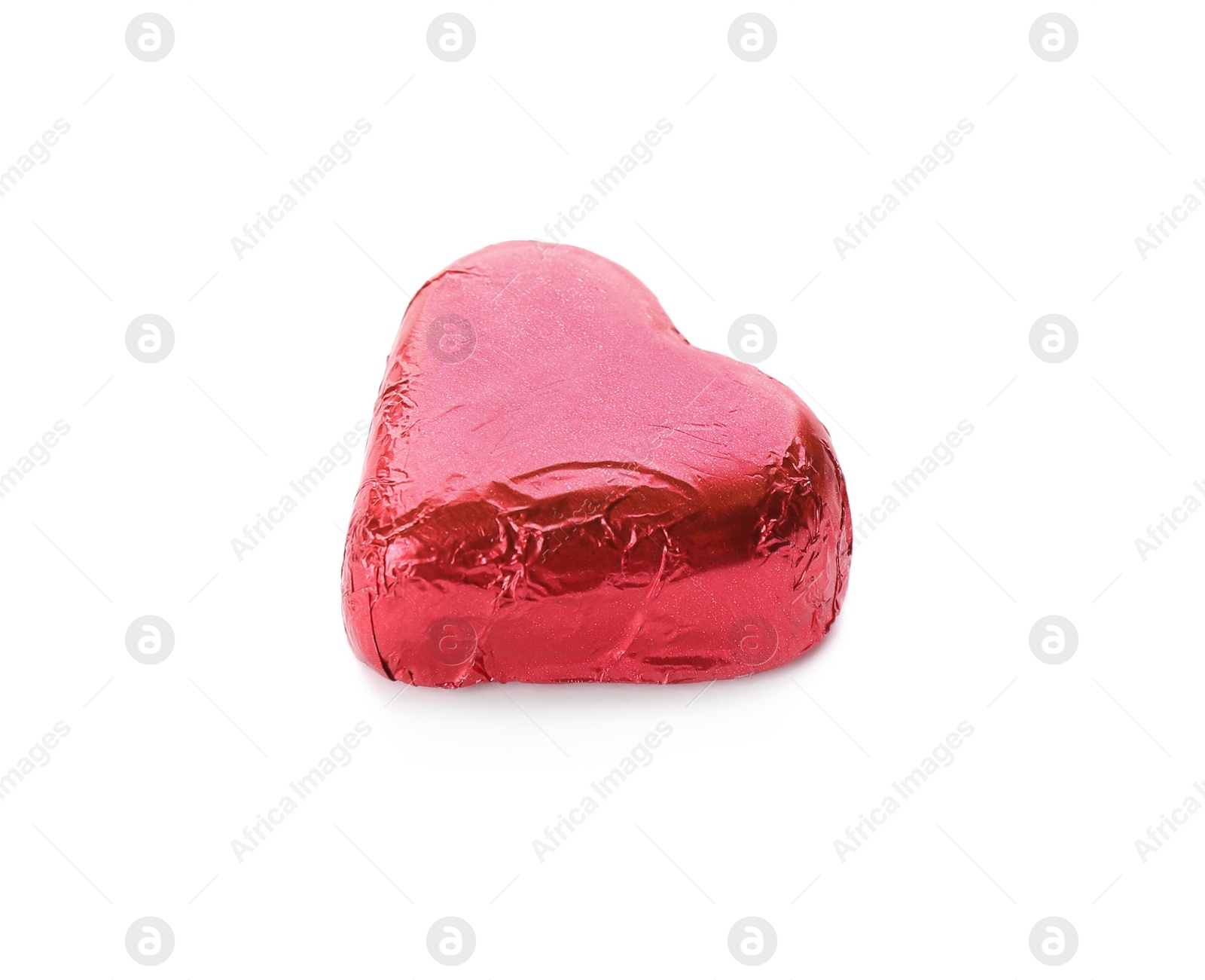 Photo of Heart shaped chocolate candy in red foil isolated on white