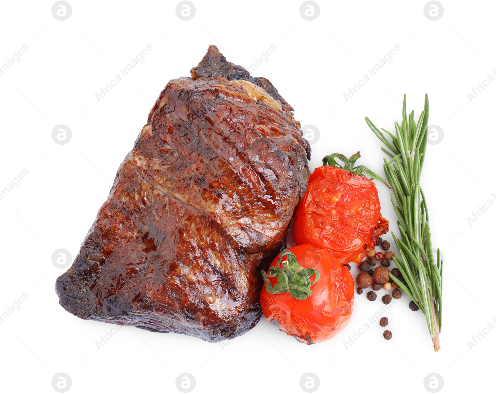 Photo of Piece of delicious grilled beef meat, tomatoes, peppercorns and rosemary isolated on white, top view