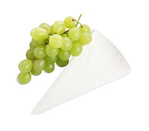 Photo of Brie cheese with grape isolated on white, top view
