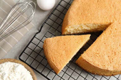 Photo of Flat lay composition with delicious fresh homemade cake on grey marble table