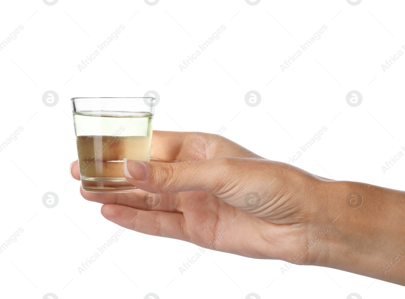 Photo of Woman holding glass with mouthwash for teeth care on white background