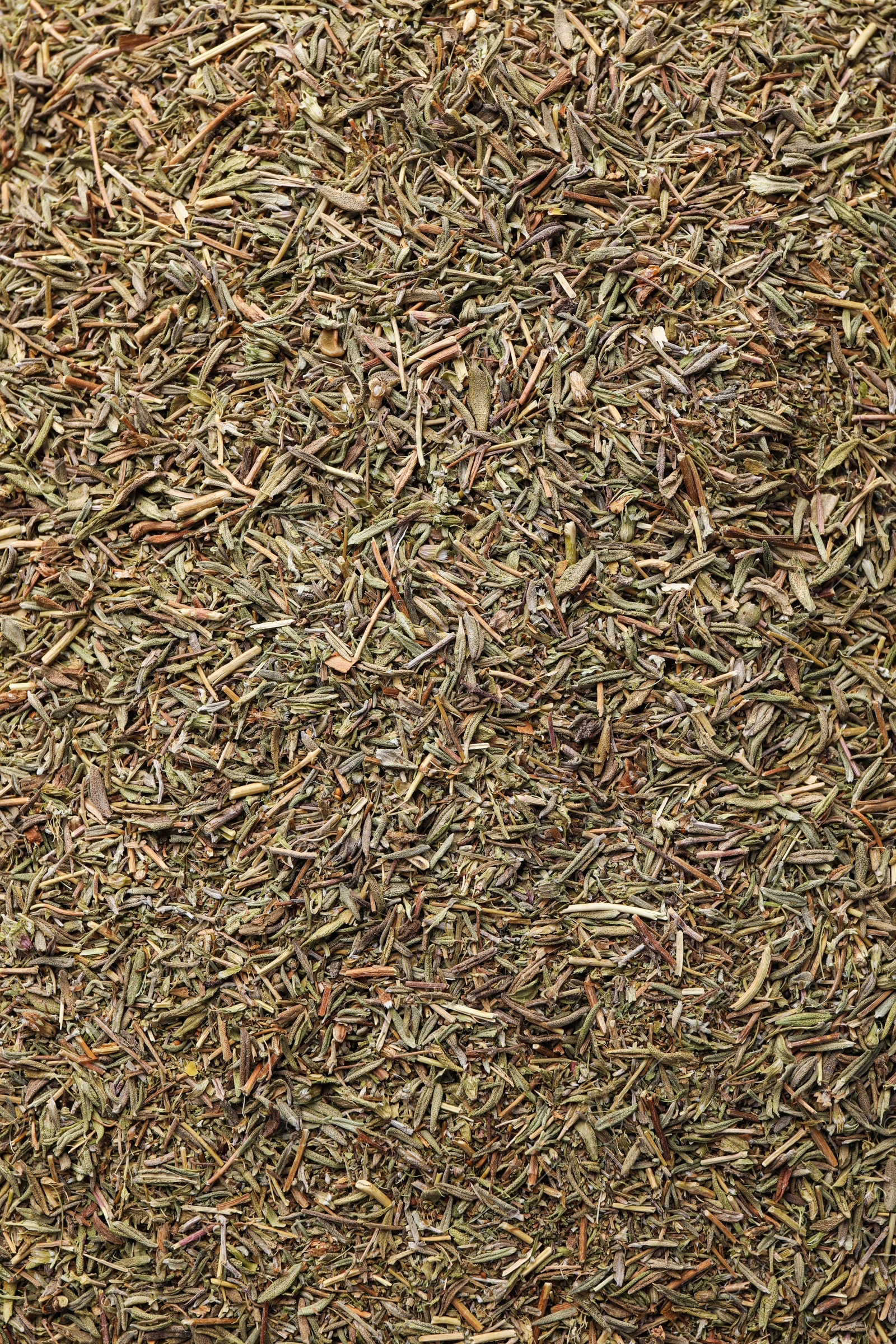 Photo of Aromatic dried basil as background, top view