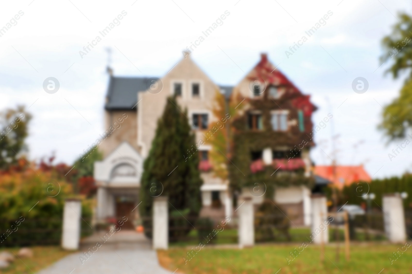 Photo of Blurred view of beautiful stylish house outdoors. Real estate for rent