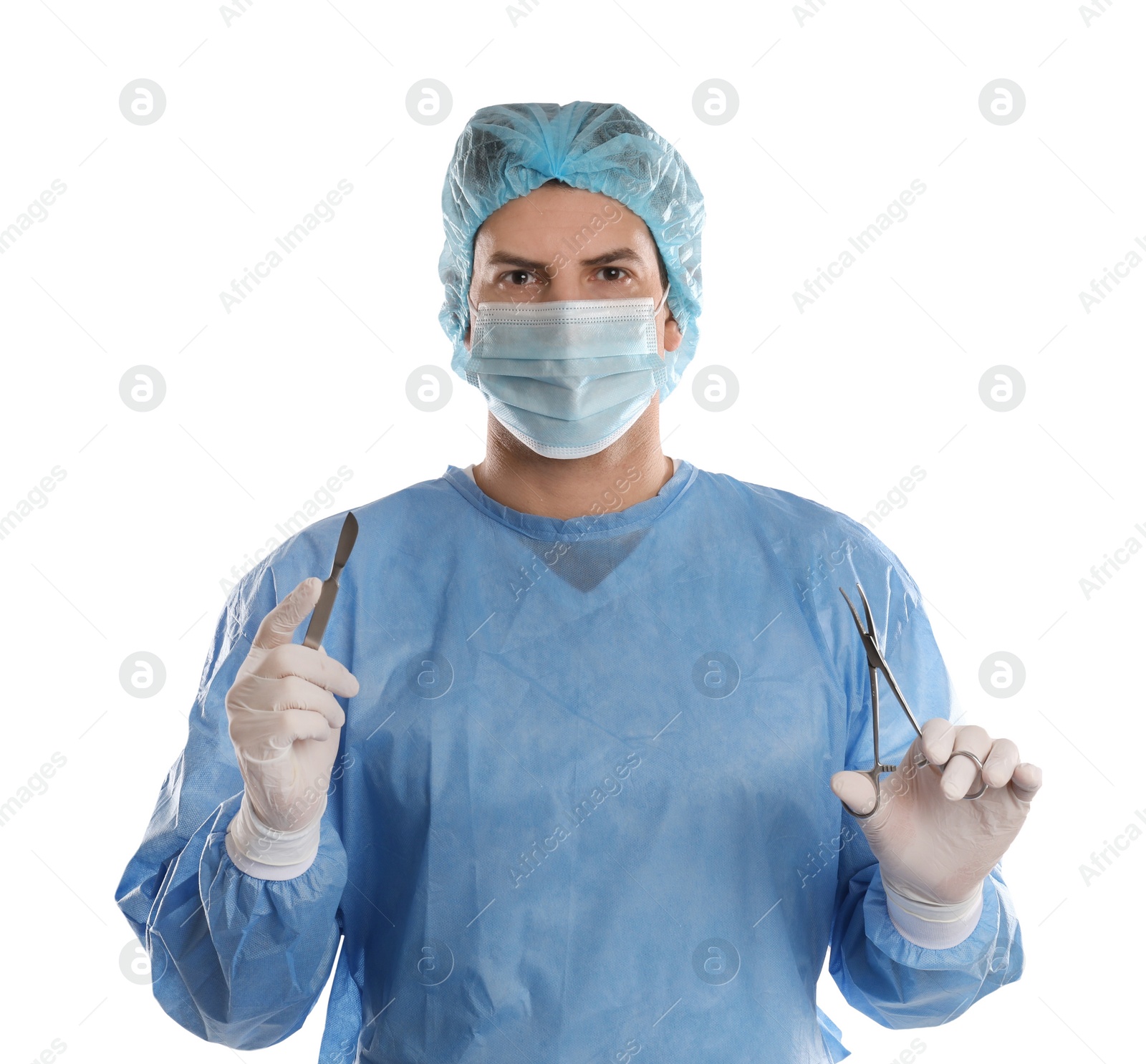 Photo of Doctor holding medical clamps and scalpel on light background. Surgical instruments