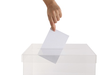 Woman putting her vote into ballot box on white background, closeup