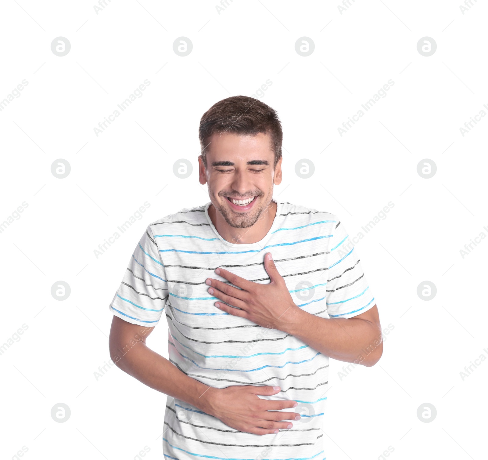 Photo of Portrait of handsome young man laughing on white background