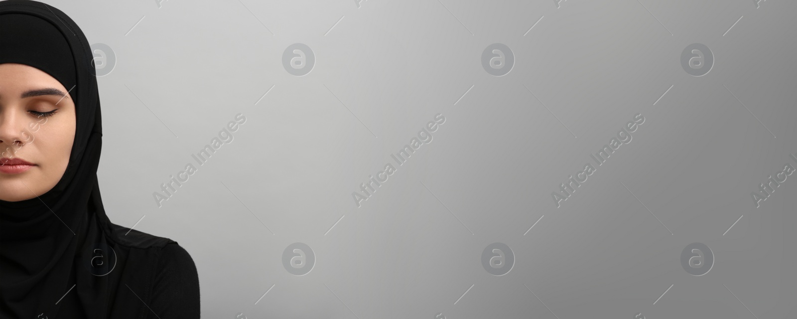 Image of Portrait of Muslim woman in hijab on grey background, space for text. Banner design