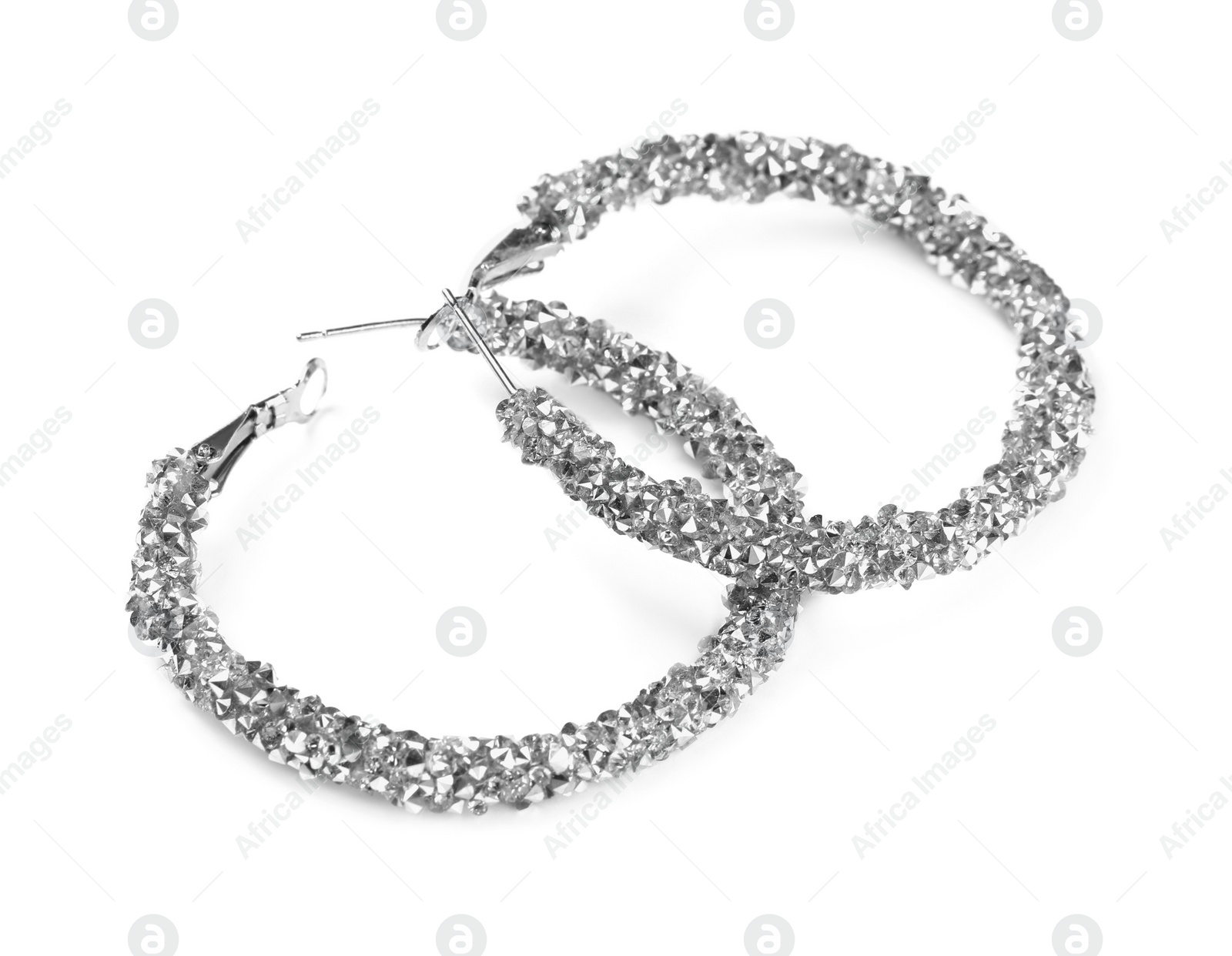 Photo of Elegant earrings with gemstones isolated on white. Luxury jewelry