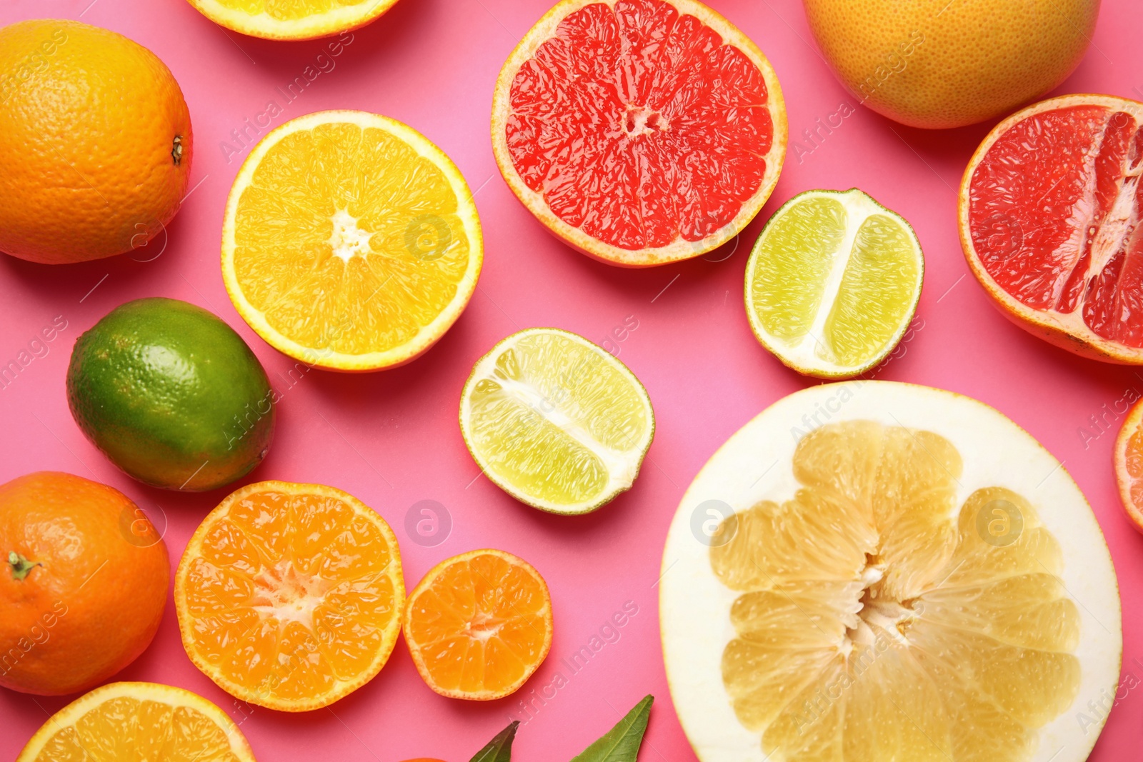 Photo of Different citrus fruits on color background, top view