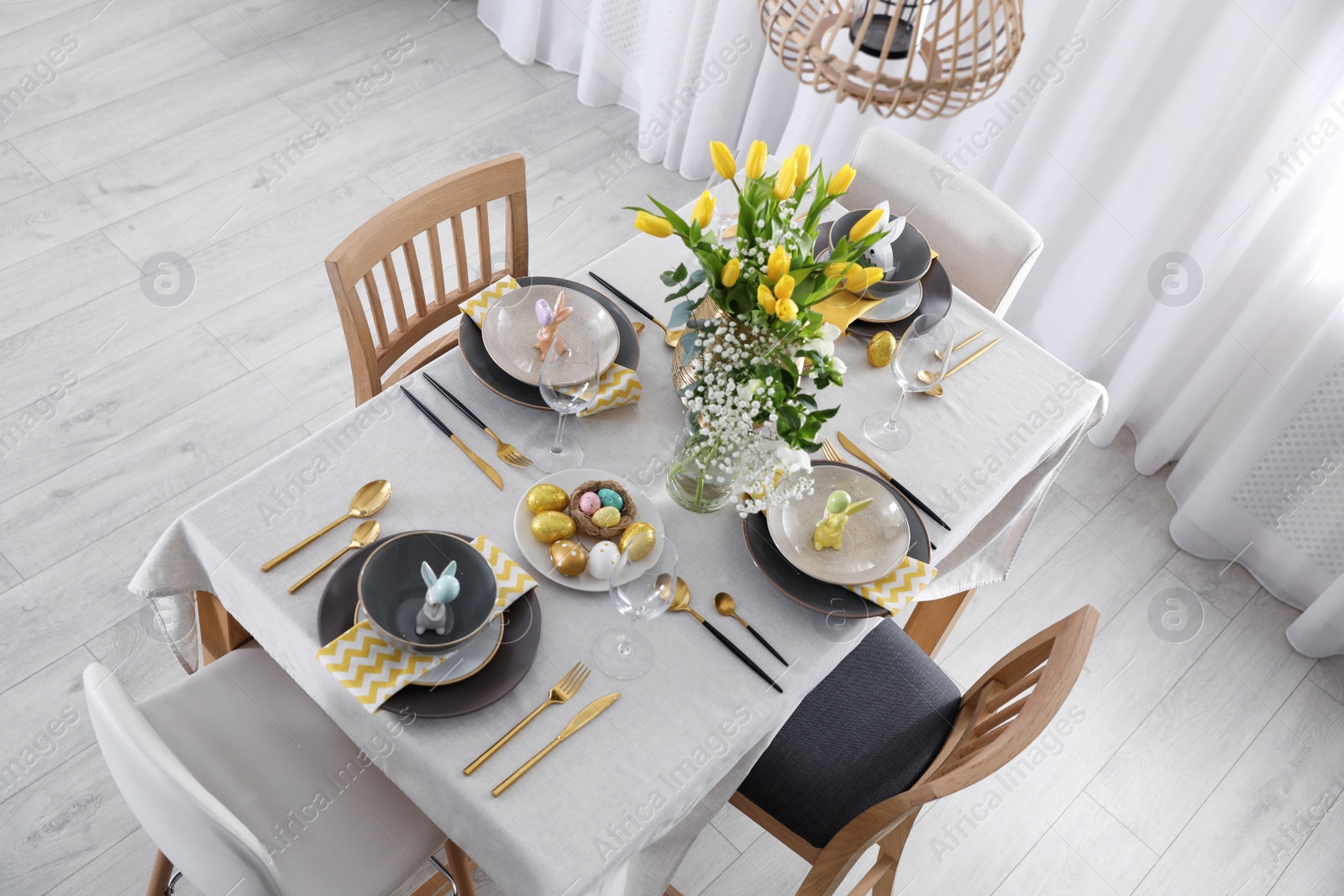 Photo of Beautiful Easter table setting with festive decor indoors, above view