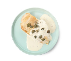 Delicious cooked chicken fillet with capers and sauce on white background, top view