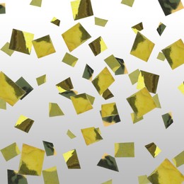 Shiny golden confetti falling on light grey background