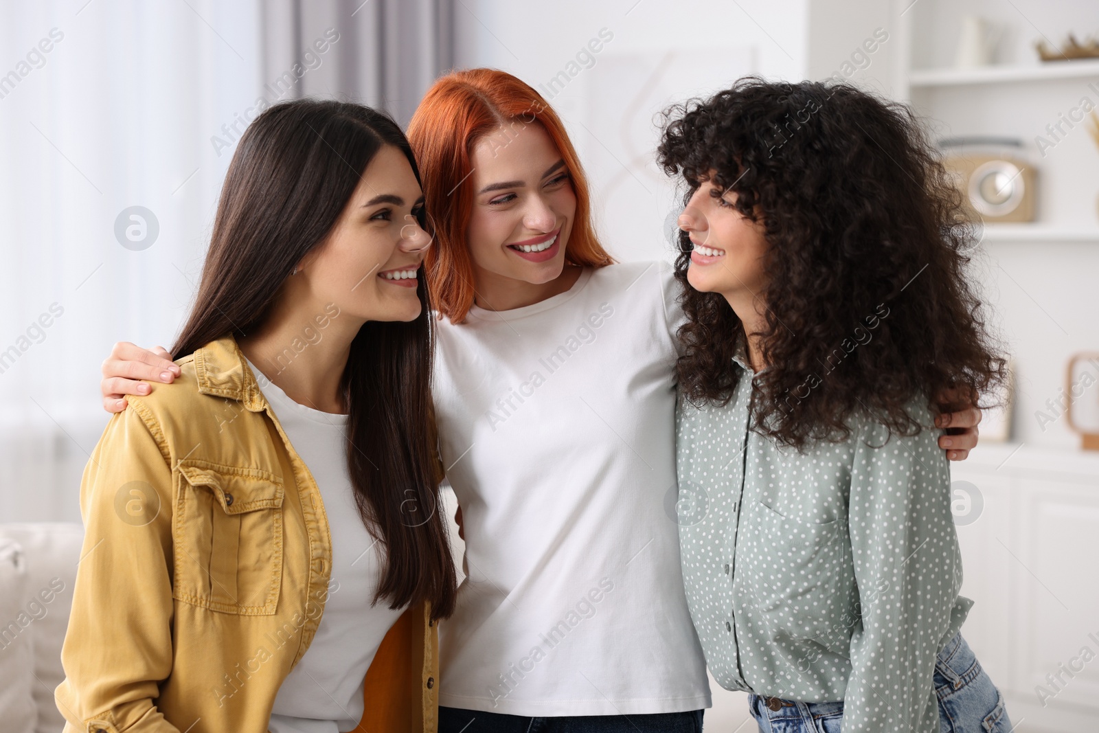 Photo of Happy young friends spending time together at home