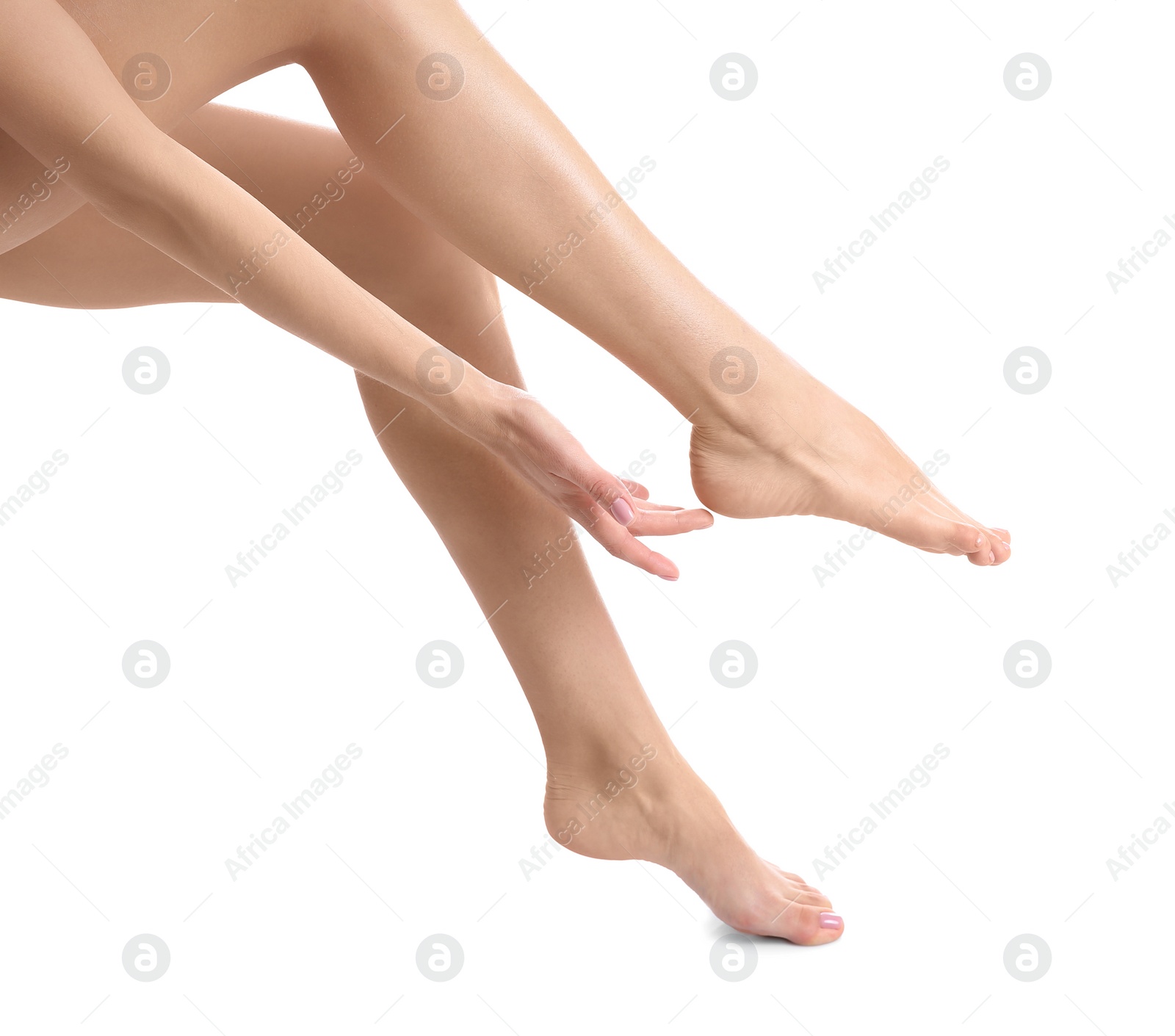 Photo of Woman with beautiful legs and feet on white background, closeup. Spa treatment