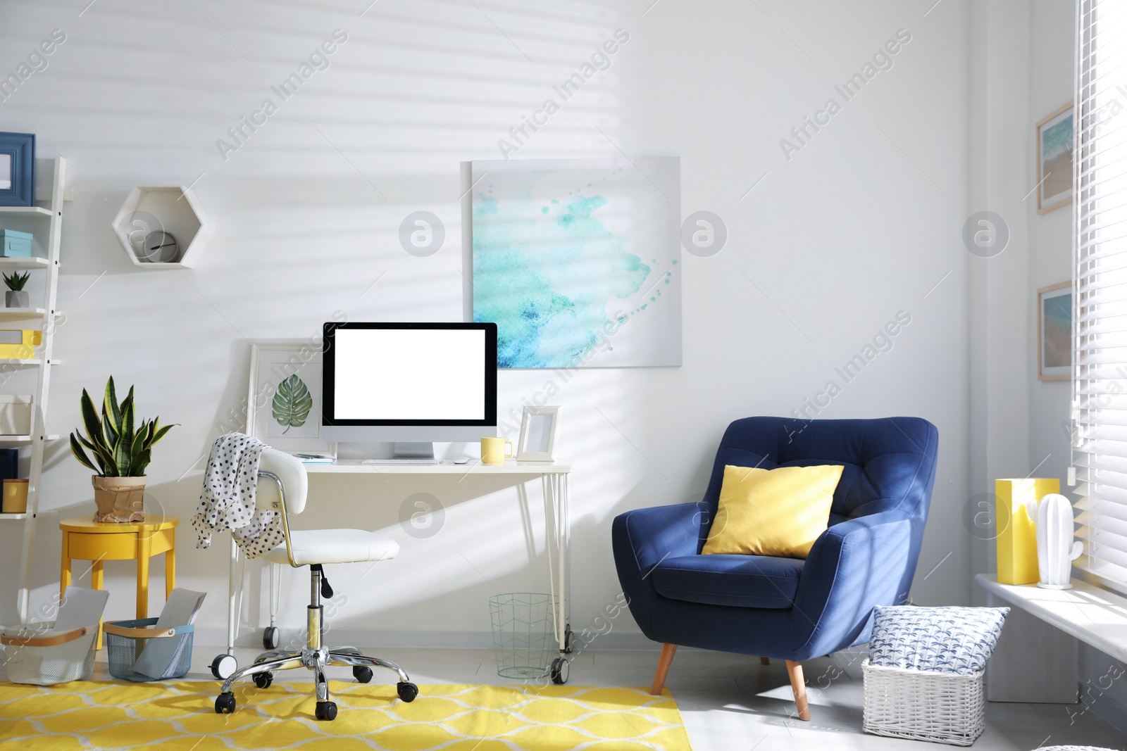 Photo of Comfortable office chair near desk with modern computer indoors