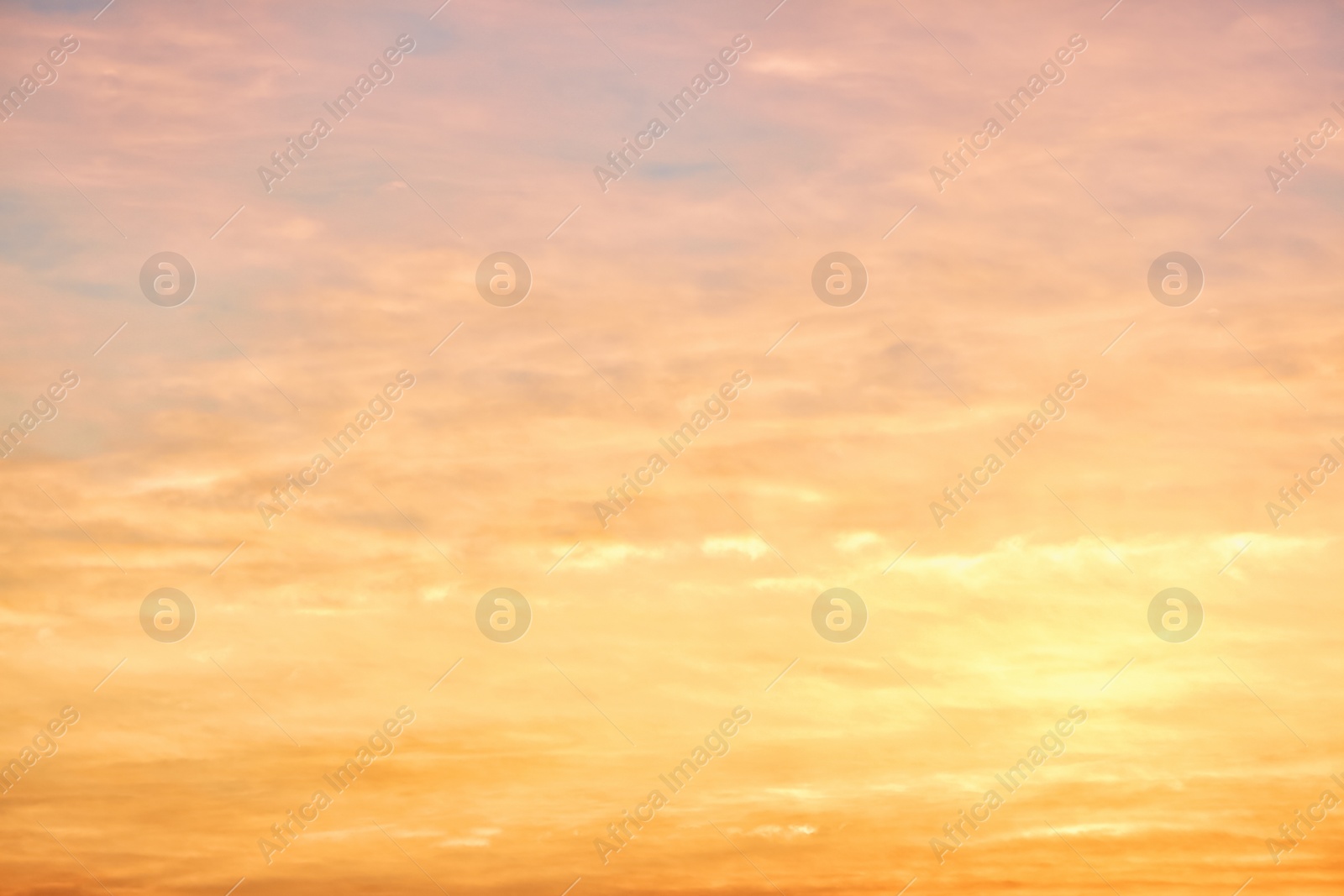 Photo of Picturesque view of beautiful sky lit by setting sun