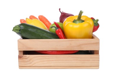 Fresh ripe vegetables and fruits in wooden crate on white background